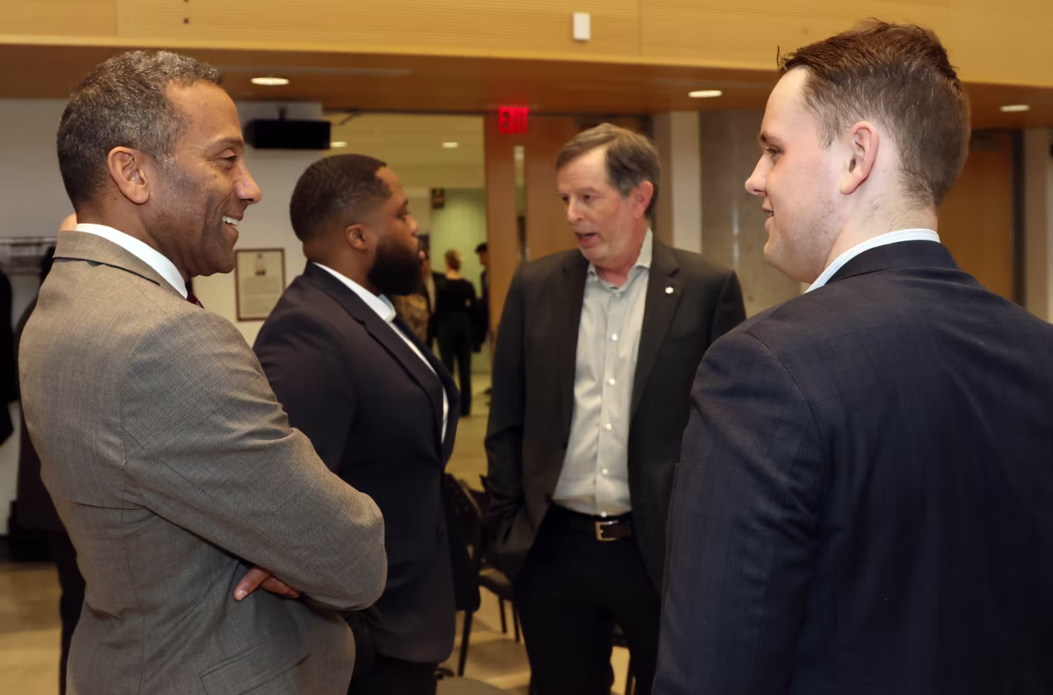 Telfer School of Management's dean, Stéphane Brutus (left), in conversation with Jacob Seifried, president and co-founder of the University of Ottawa's Real Estate Cub. Photo by Caroline Phillips.