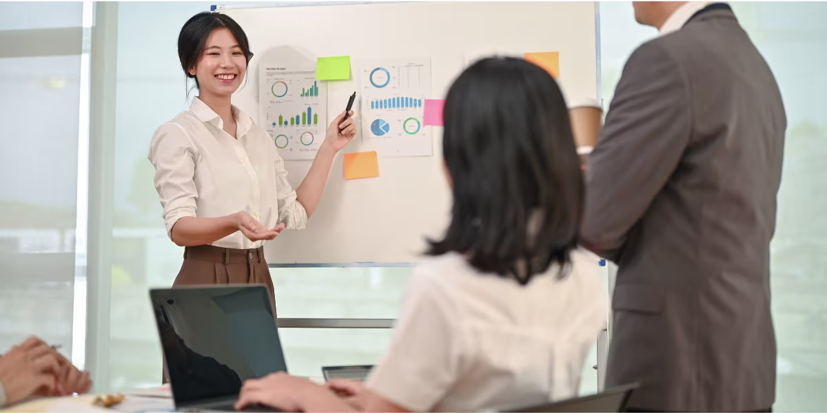 A woman pitching a business idea to three attendees