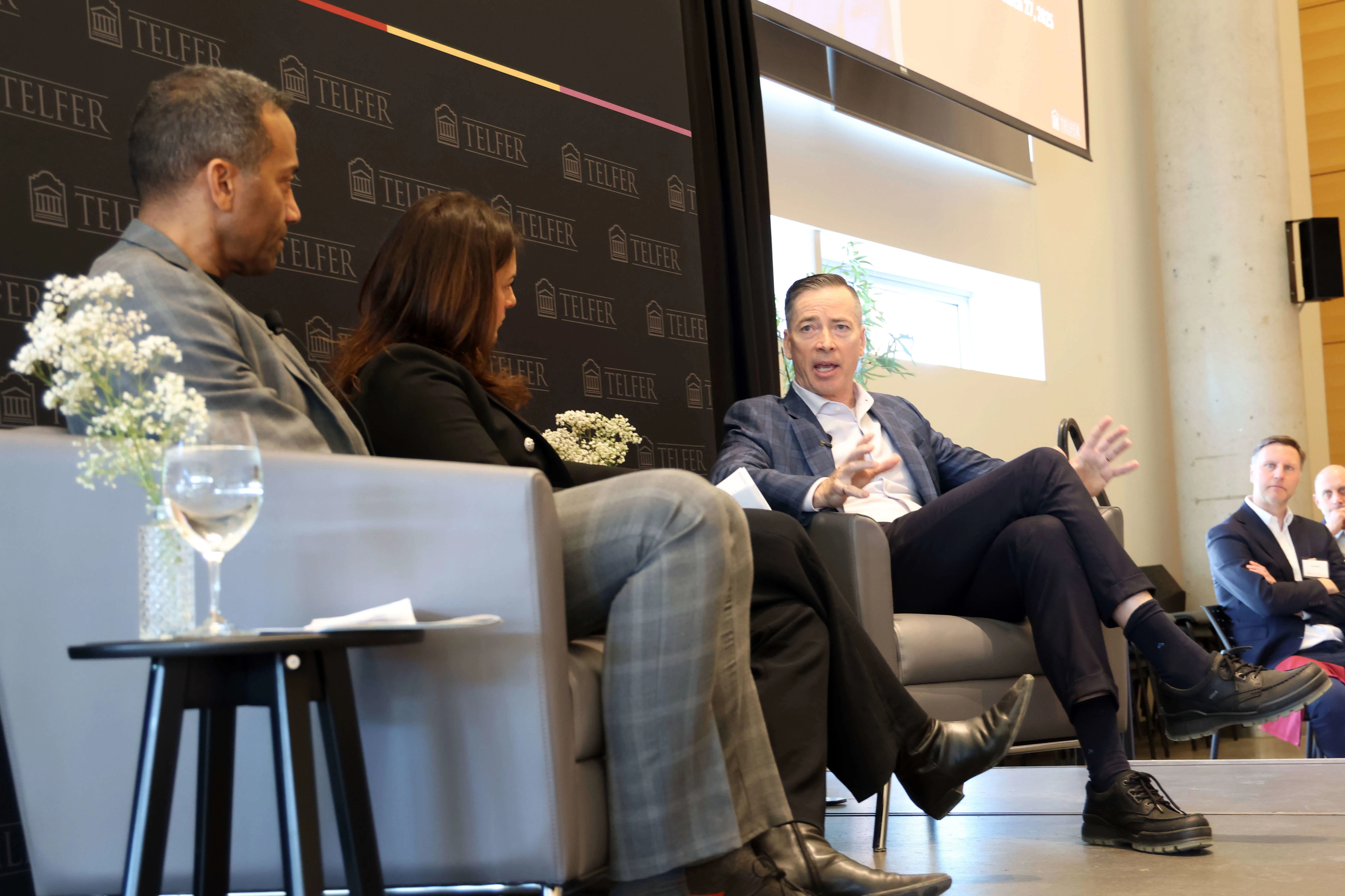 From left, Dean Stéphane Brutus, Boyden principal Leslie Feldman and CEO Andrew Waitman sitting on couches on the stage.