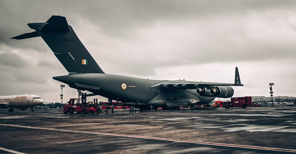 military airplane being loaded with supplies