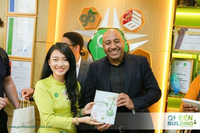 Walid and a Vietnamese stakeholder posing for a photo