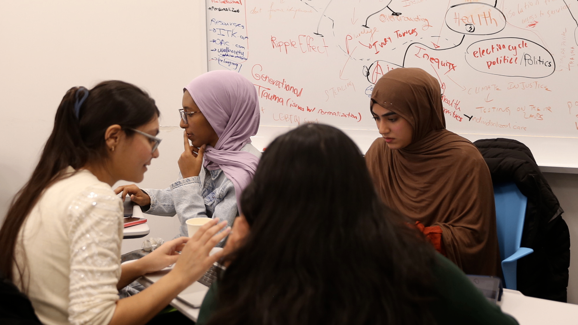 Participants from the Innovation Sprint on Preventing Youth Homelessness celebrate after 48 hours of intense collaboration