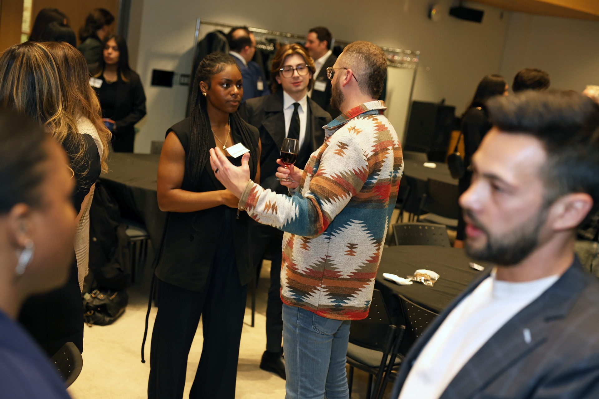 Fullscript CEO Kyle Braatz and Shopify VP Brennan Loh speak with students during the networking session