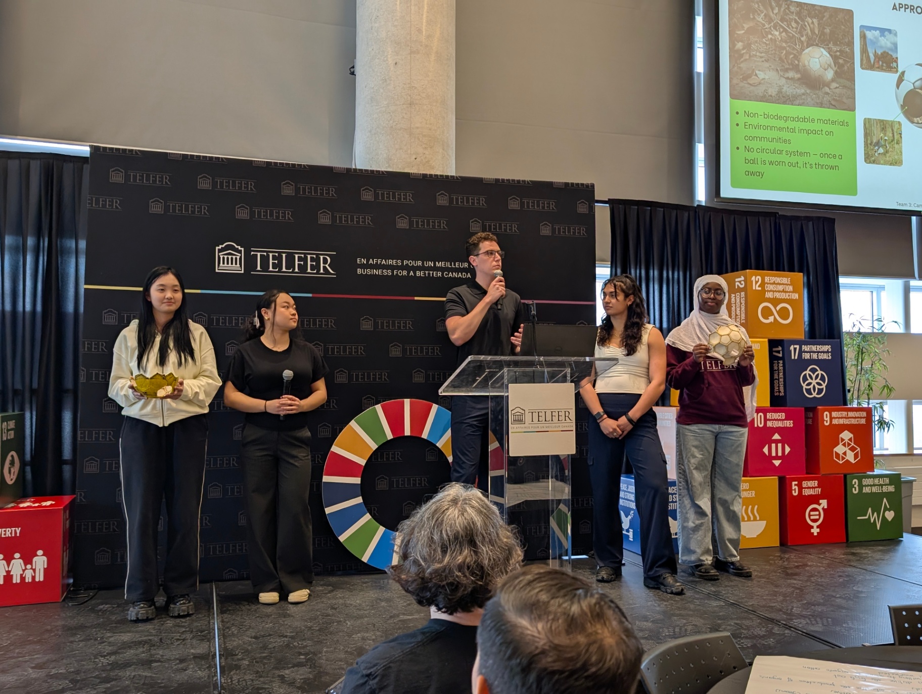 Student presenting ideas at the front of the room during the Sprint.