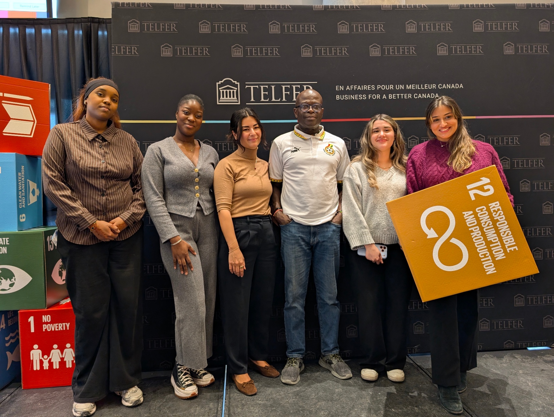 Student team posing with SDG 12 (Responsible Consumption and Production) at Telfer.