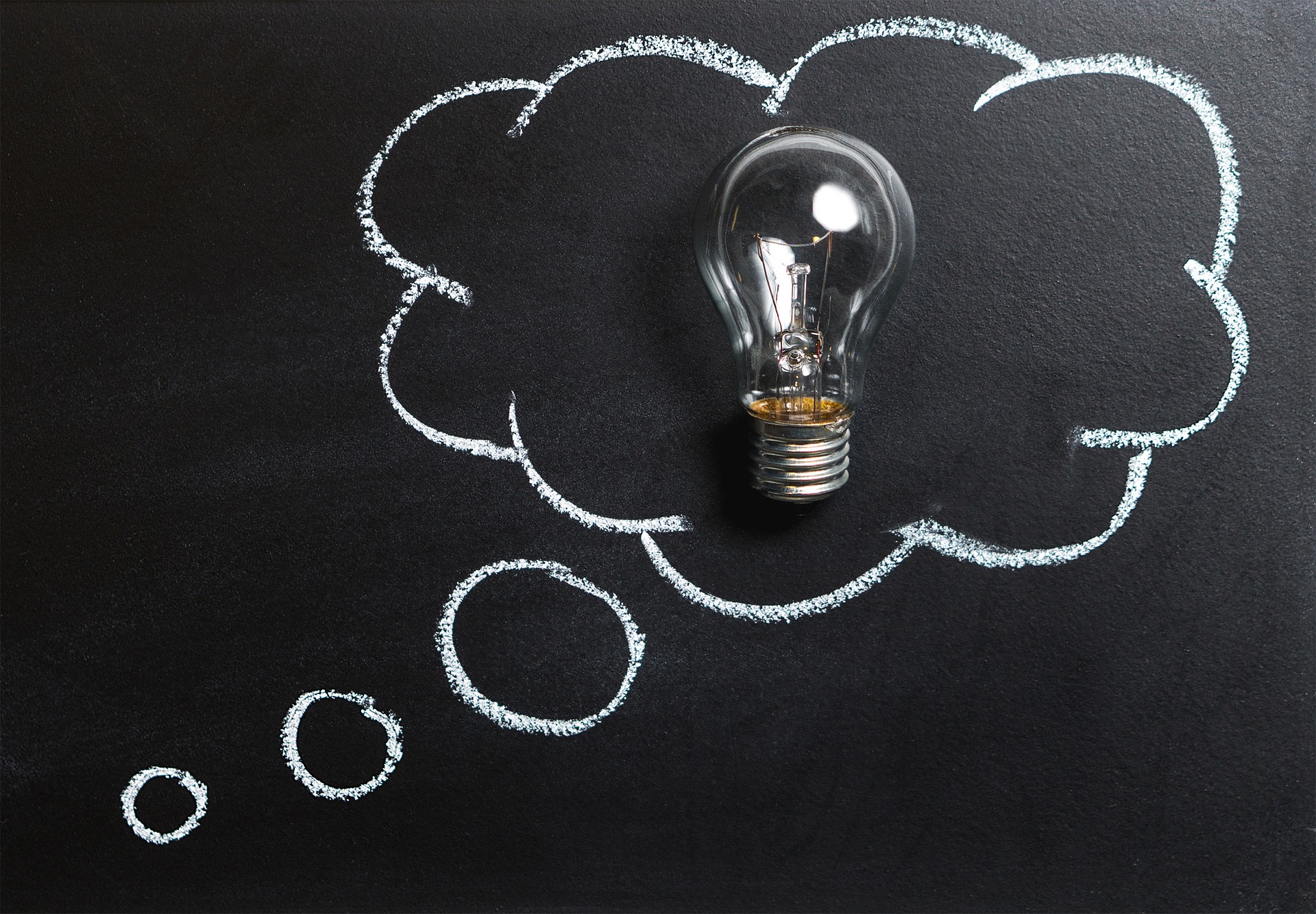 Light bulb in a thinking cloud