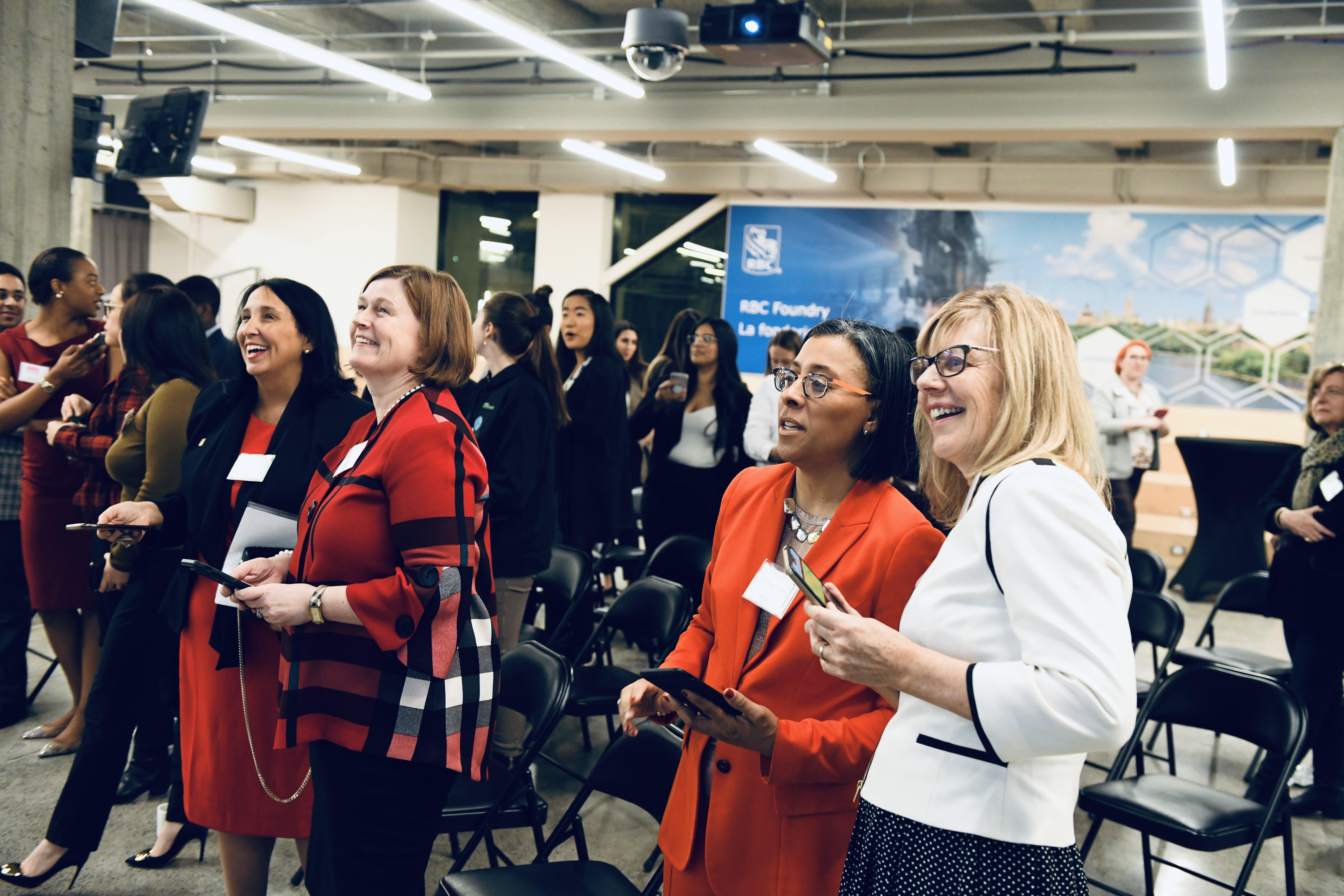 4 women looking happy and captivated