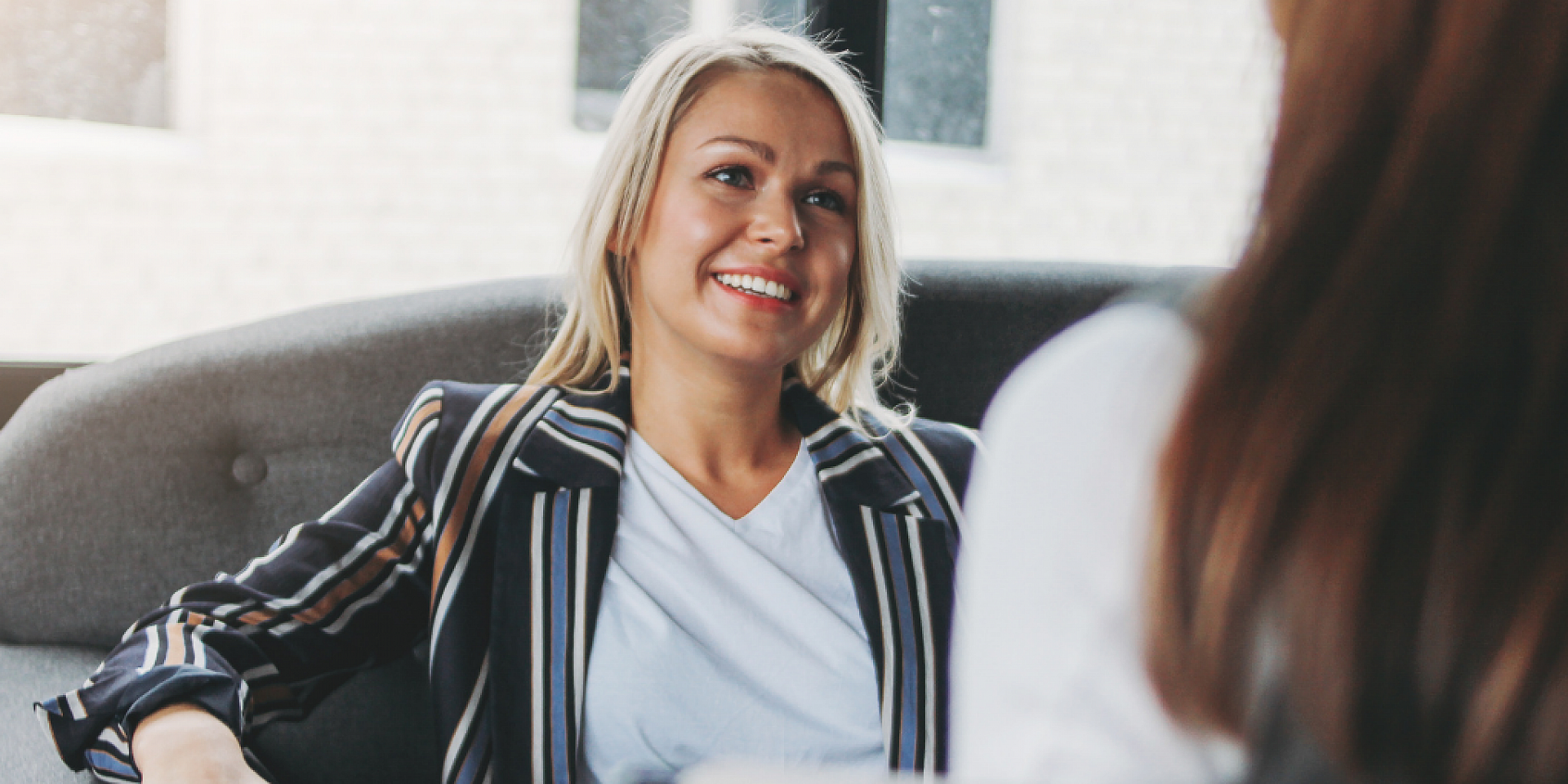 A person sitting talking to someone off camera