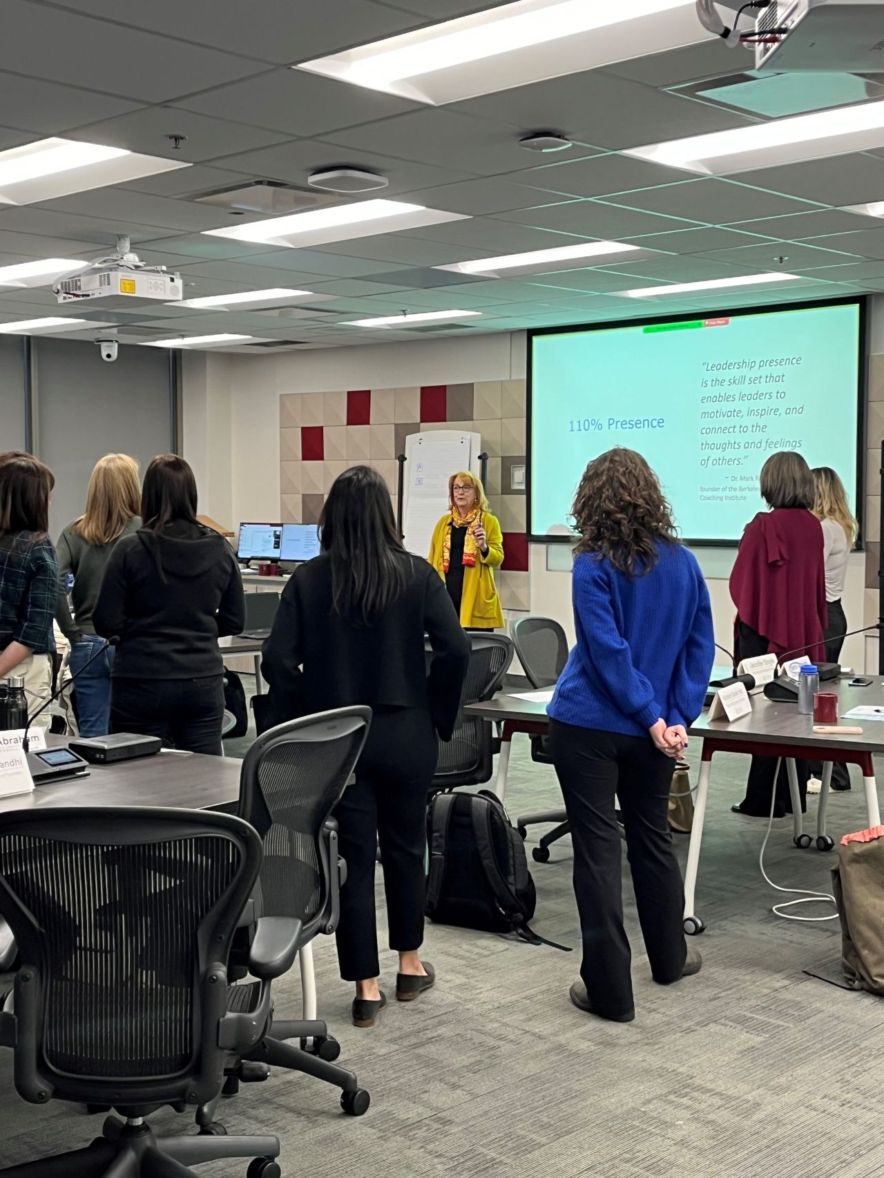 A facilitator addresses a group of women in a classroom at the Telfer Centre for Executive Leadership.