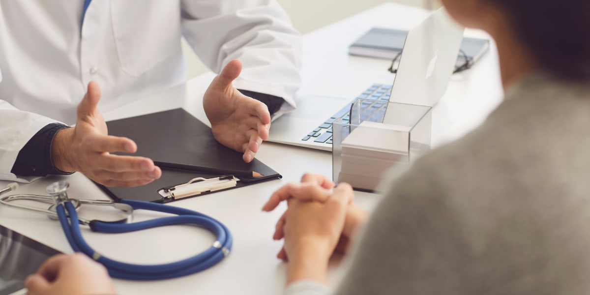 A patient having a discussion with her doctor