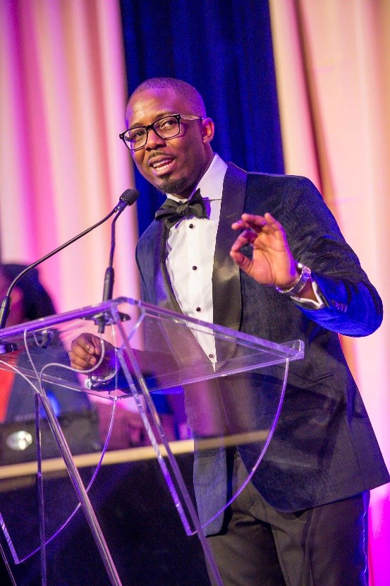 Abdul-Aziz Garuba Jr giving a speach at an event