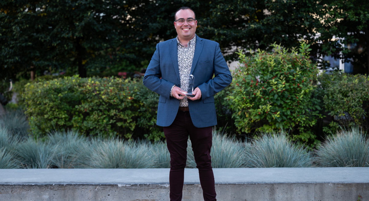 Adam Tomaszewski holding the Young Donor Award