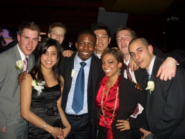 Adbul-Aziz Garuba Jr posing with a group of people at an event