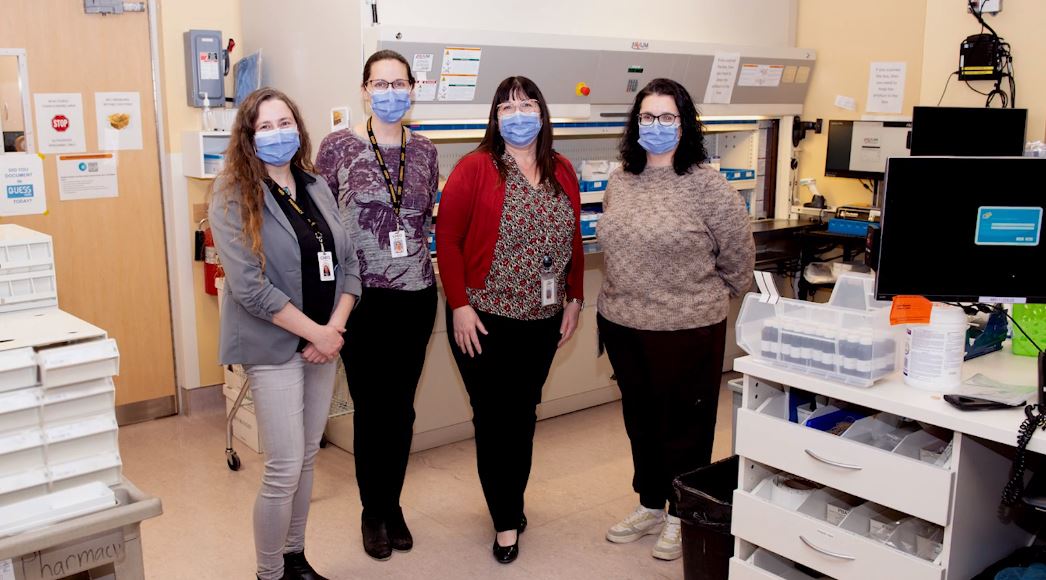 Ariane Blanc with CHEO staff in the hospital pharmacy