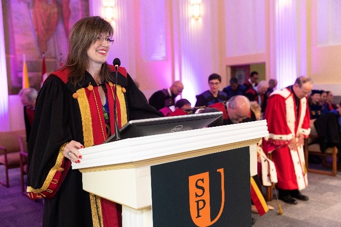 Carole Breton, Telfer Executive MBA Graduate 2021 at a Saint Paul University work event dressed in her Vice Rector robe