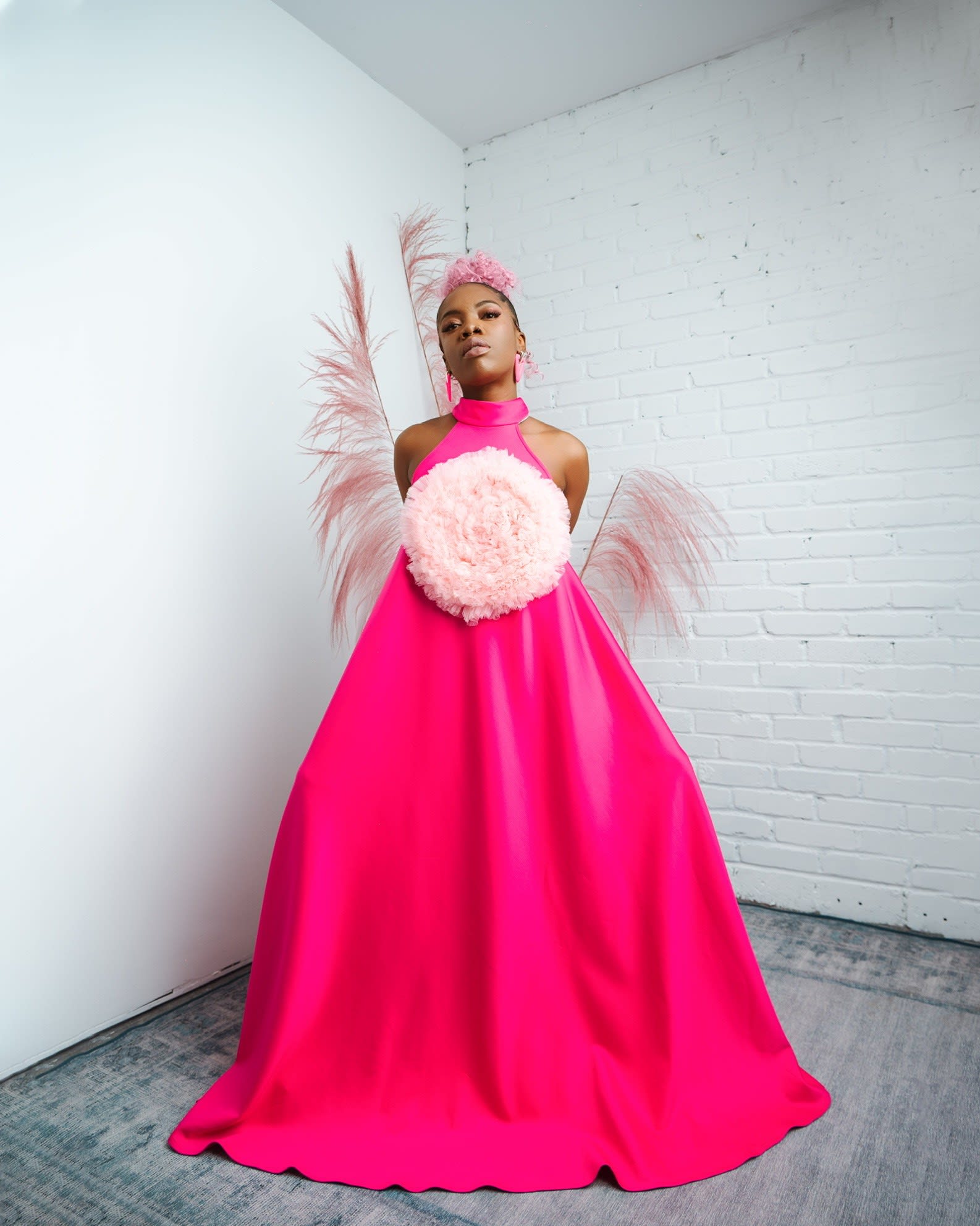 Chizoba wearing one of her pink designer dresses.