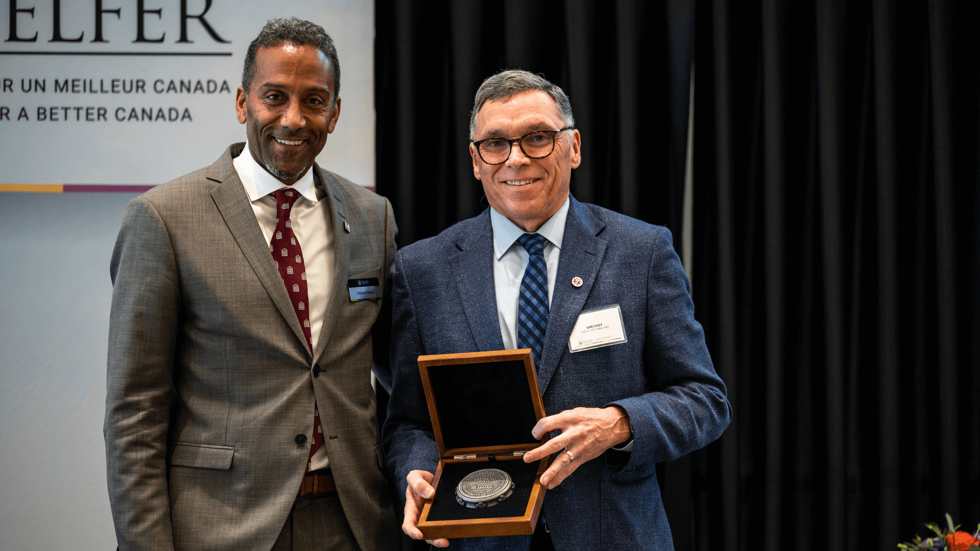 Dan Casey stands next to Dean Stéphane Brutus with Trudeau Medal