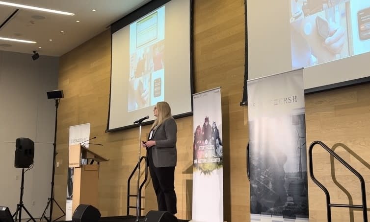Danielle Cruise, Telfer PhD student, presenting on stage at the SSHRC Storytellers competition