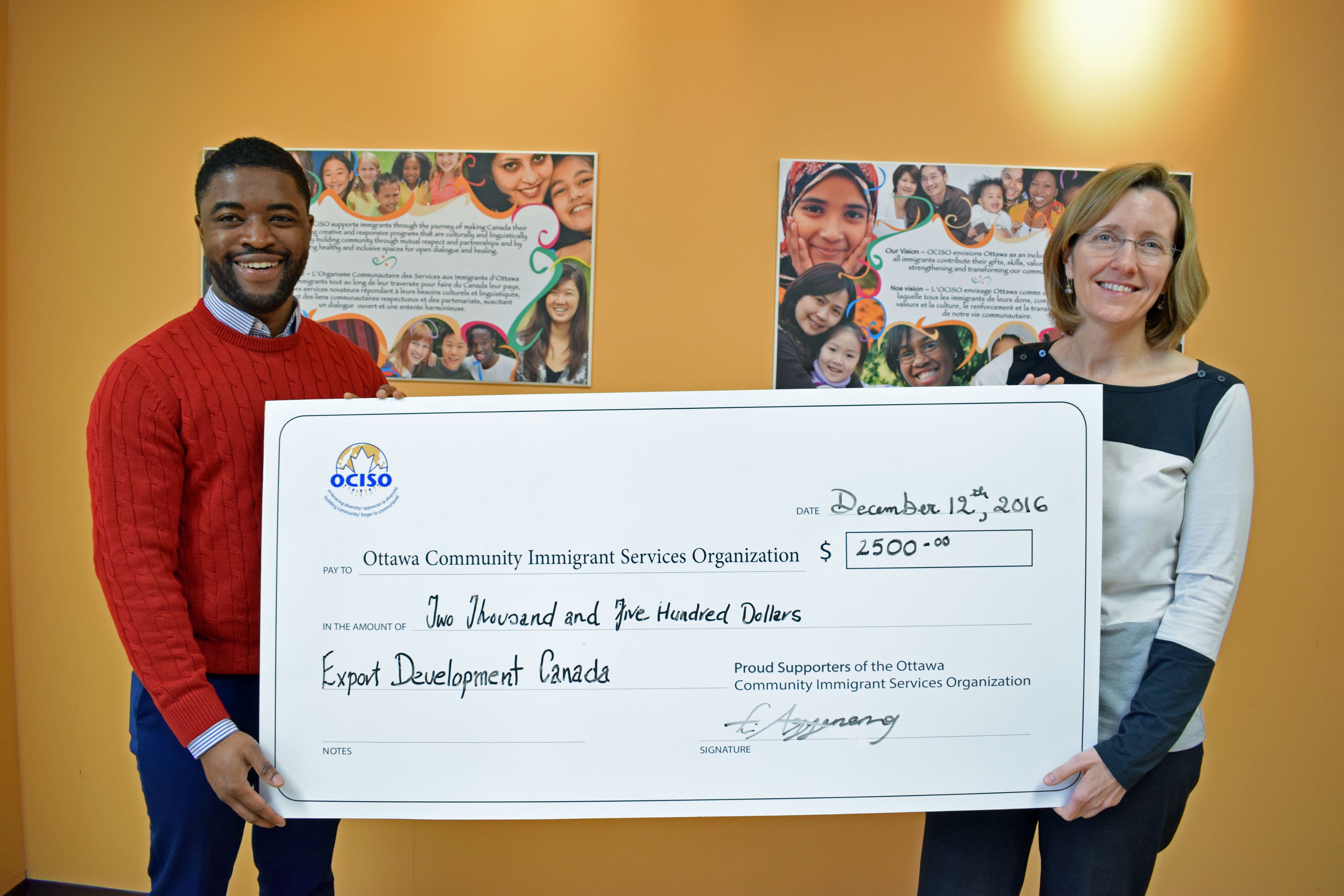 Eric Agyemang presenting EDC Community Donation to OCISO.