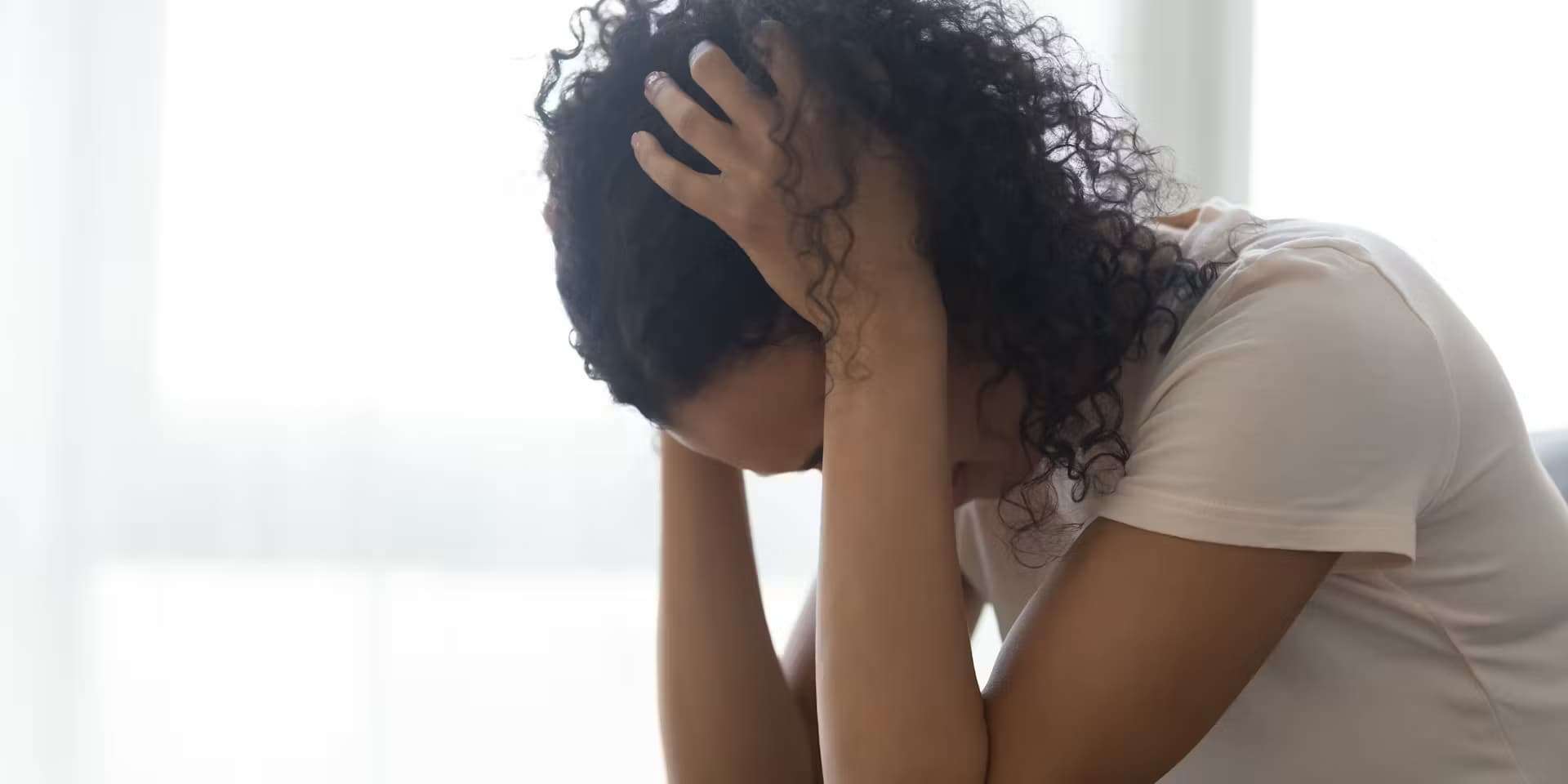 Woman holding her head