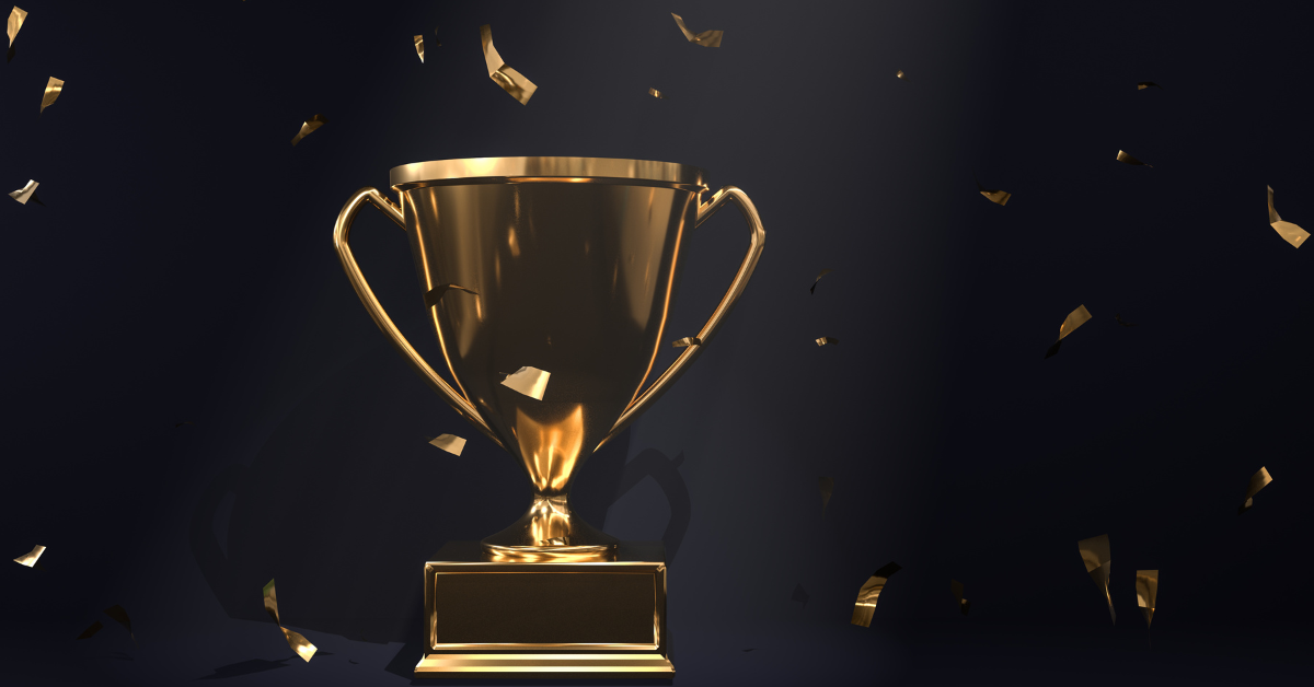 Golden trophy with falling confetti