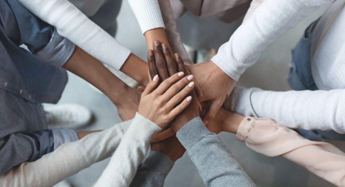 Group of people holding hands