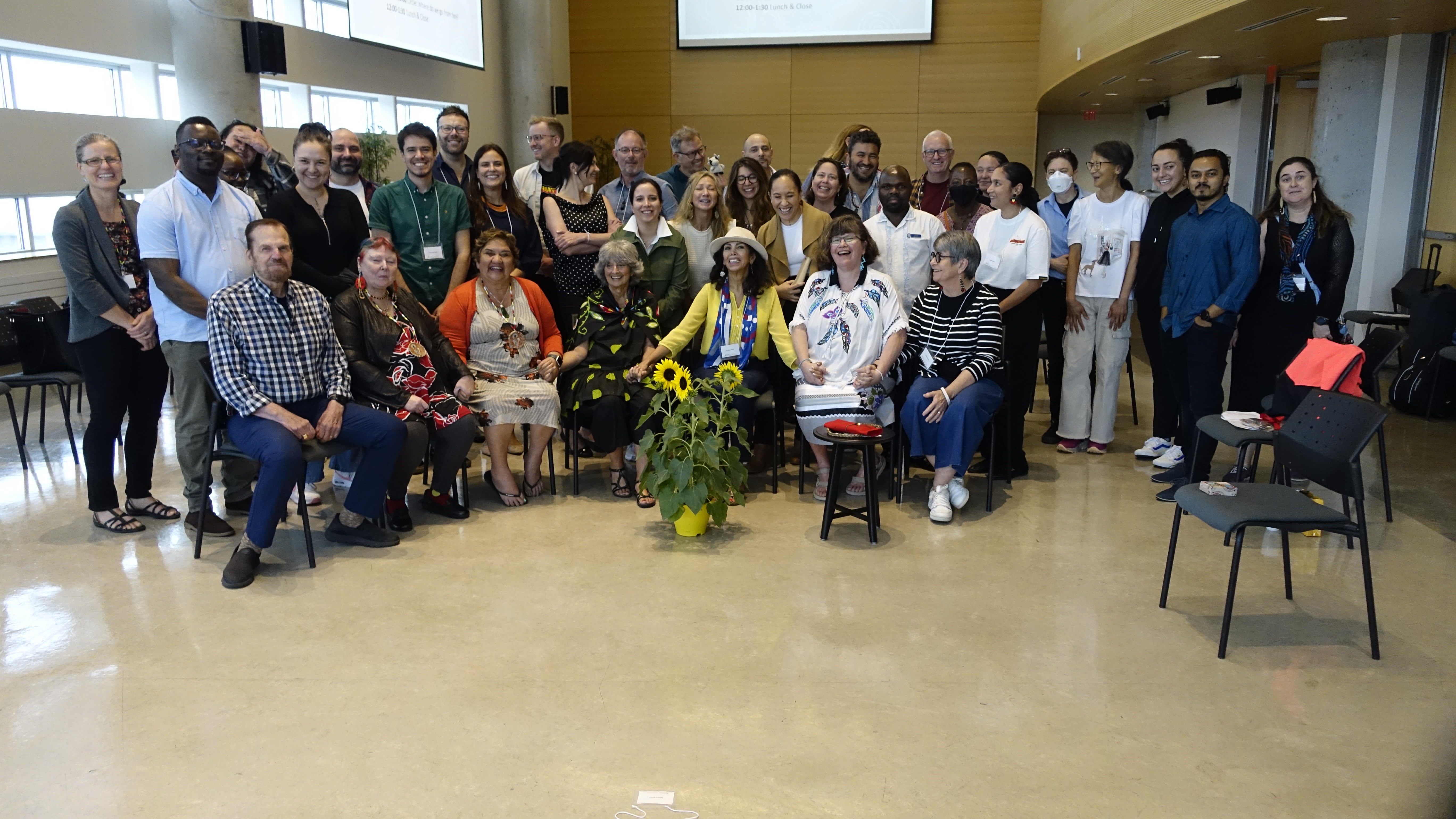 Group photo of smiling IARIMOS participants