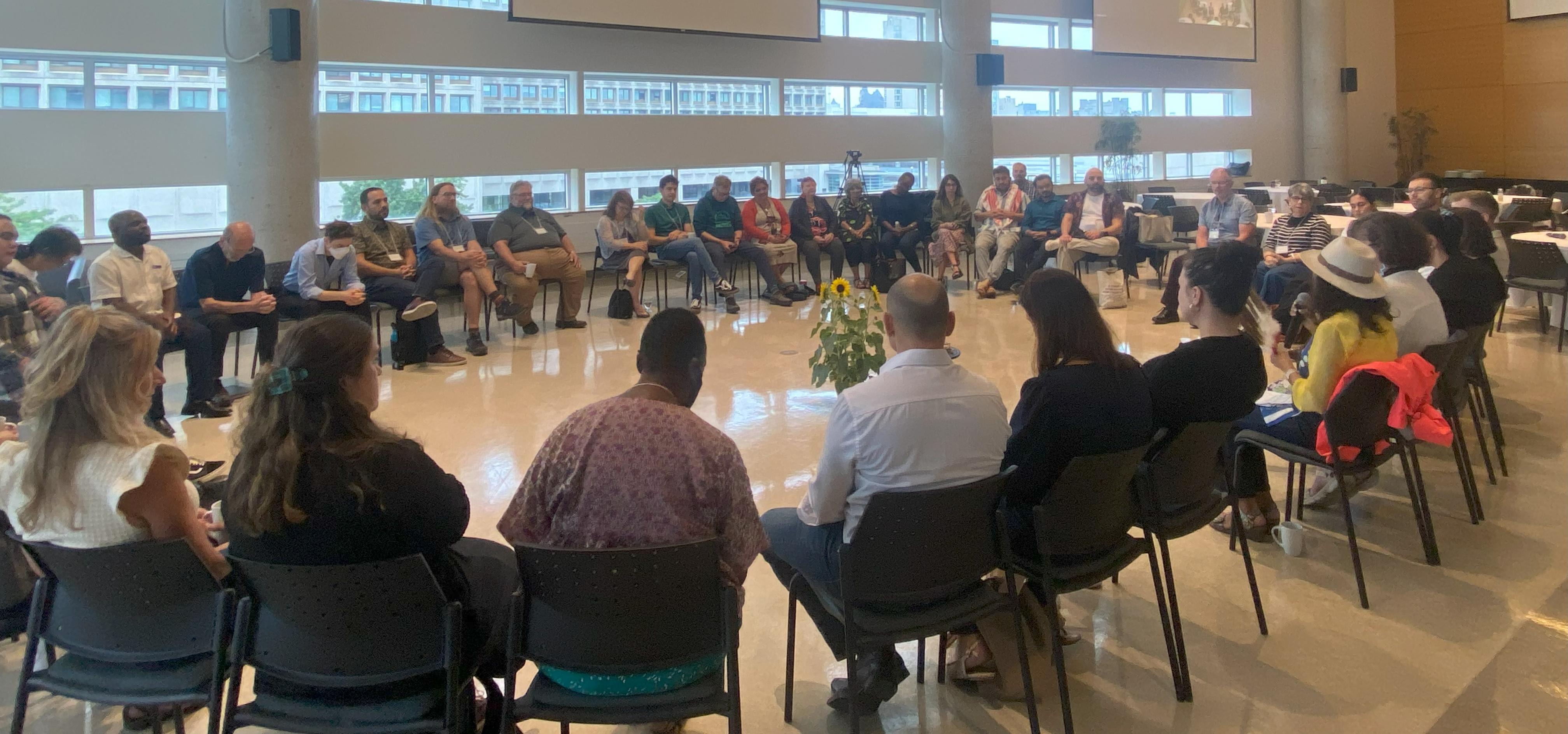 IARIMOS attendees seated in a circle
