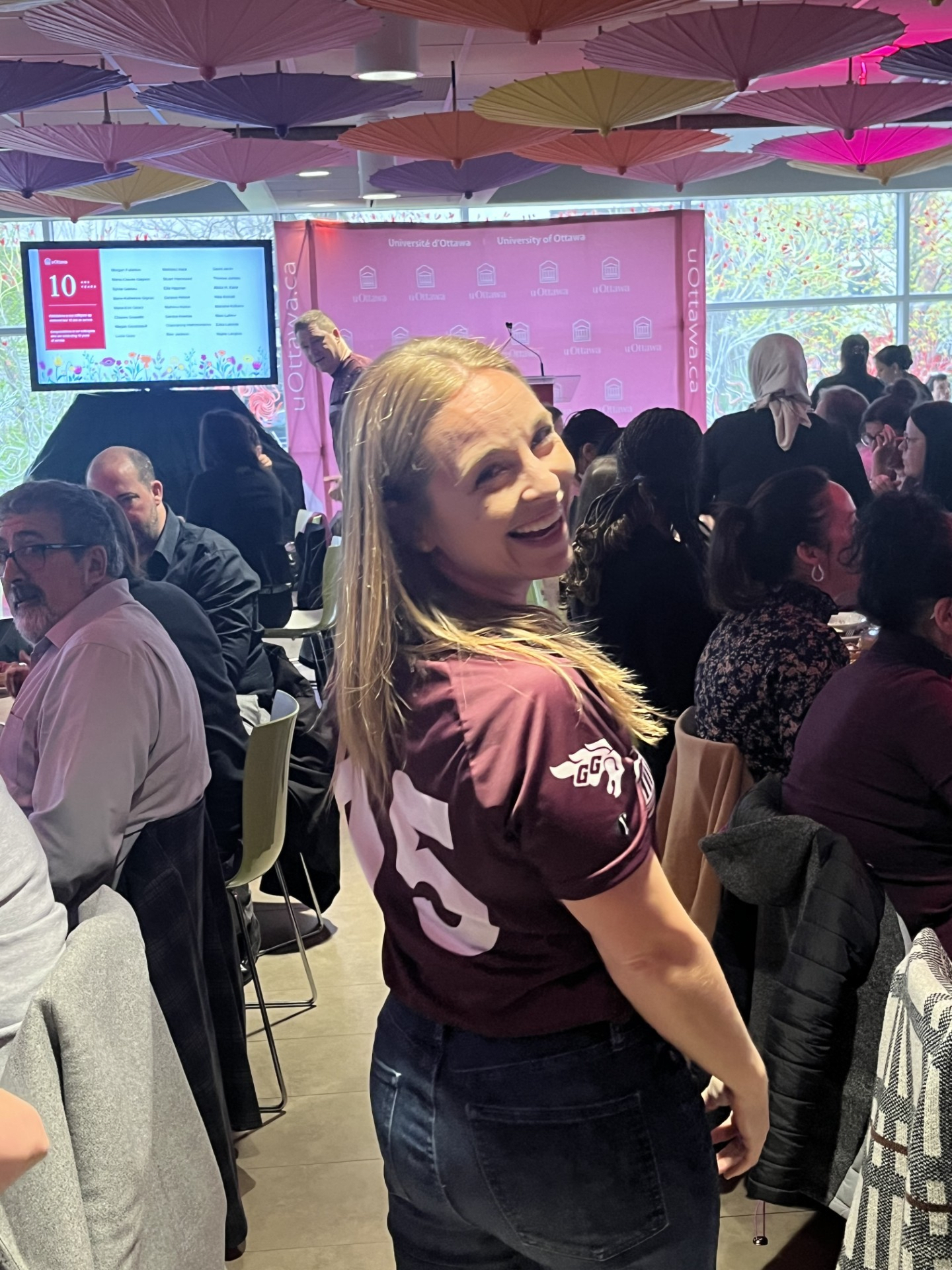 Amanda Richardson smiling while wearing a University of Ottawa jersey.