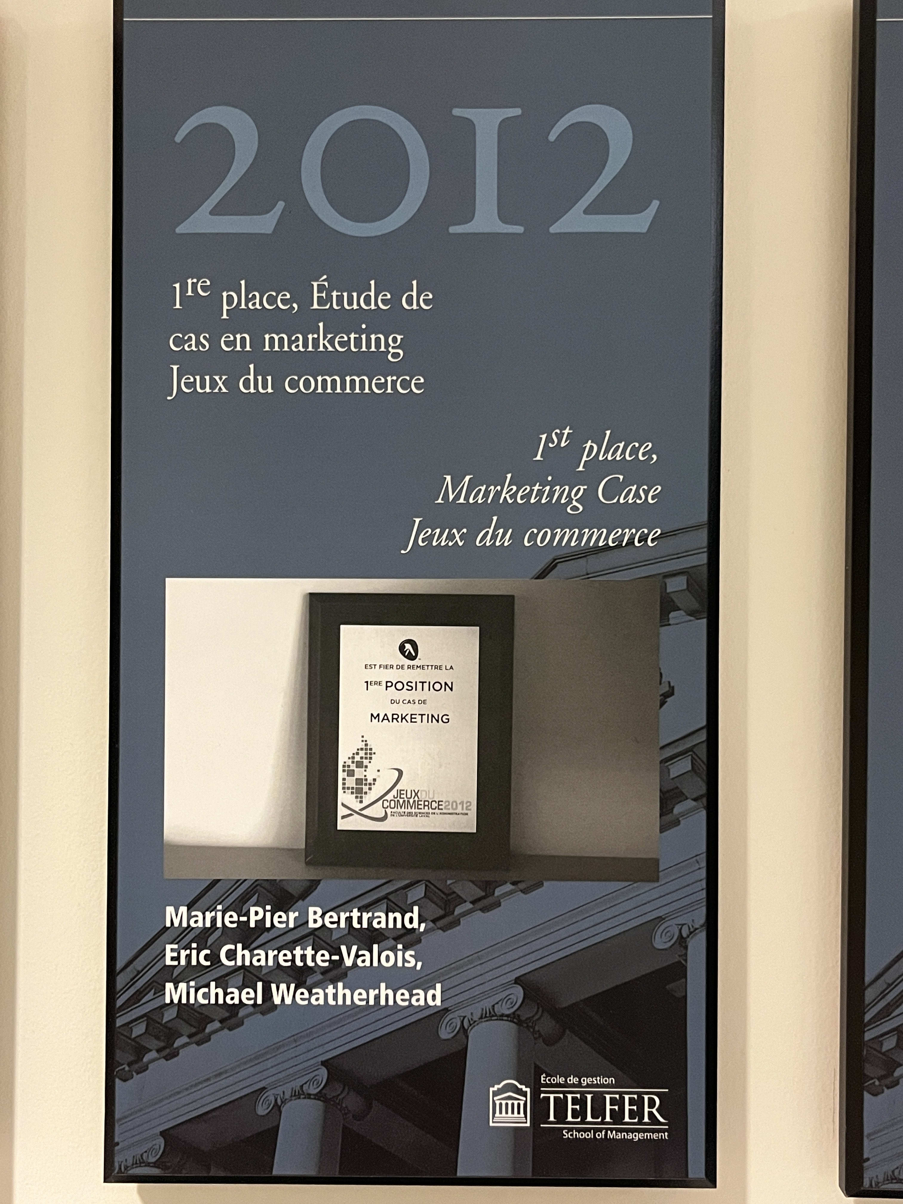 A poster reading "2012" with a plaque for 1st place in a marketing case competition.
