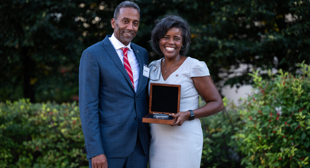 Jacqueline Rigg posing with Dean Stéphane Brutus after receiving the R. Trudeau Medal
