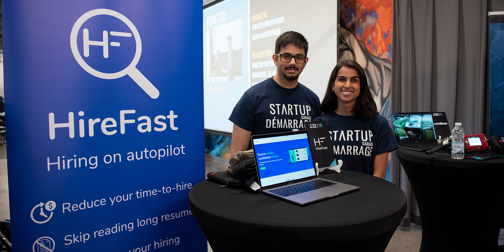 Karim Alibhai and Alina Jahani HireFast founder posing at a fair booth