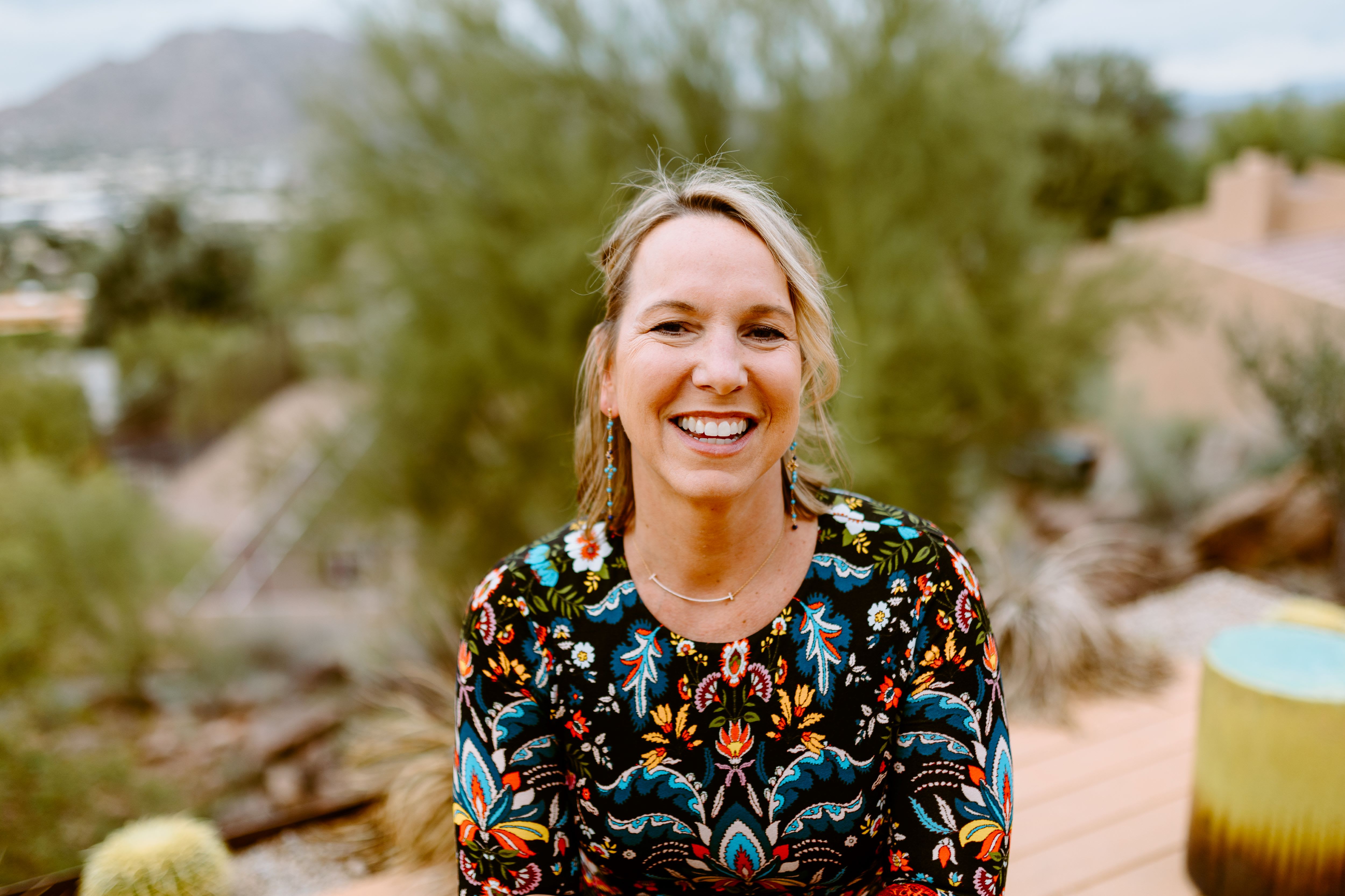 Kathryn Tremblay sitting outside wearing a patterned long-sleeve