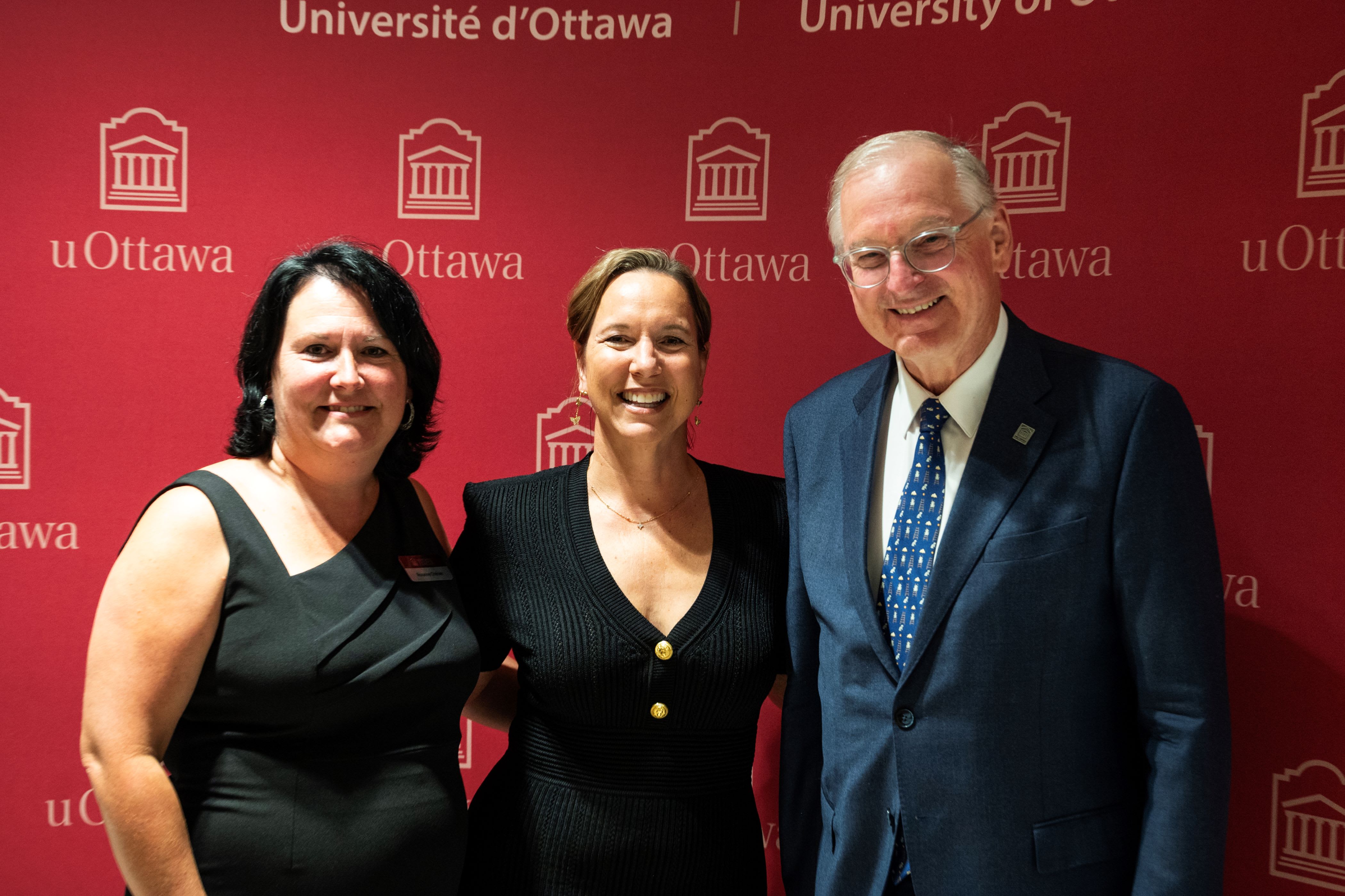 Kathryn Tremblay standing with Roxanne Chénier and Jacques Frémont