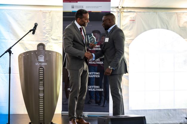 Kesi Olafimihan shaking hands with Stéphane Brutus