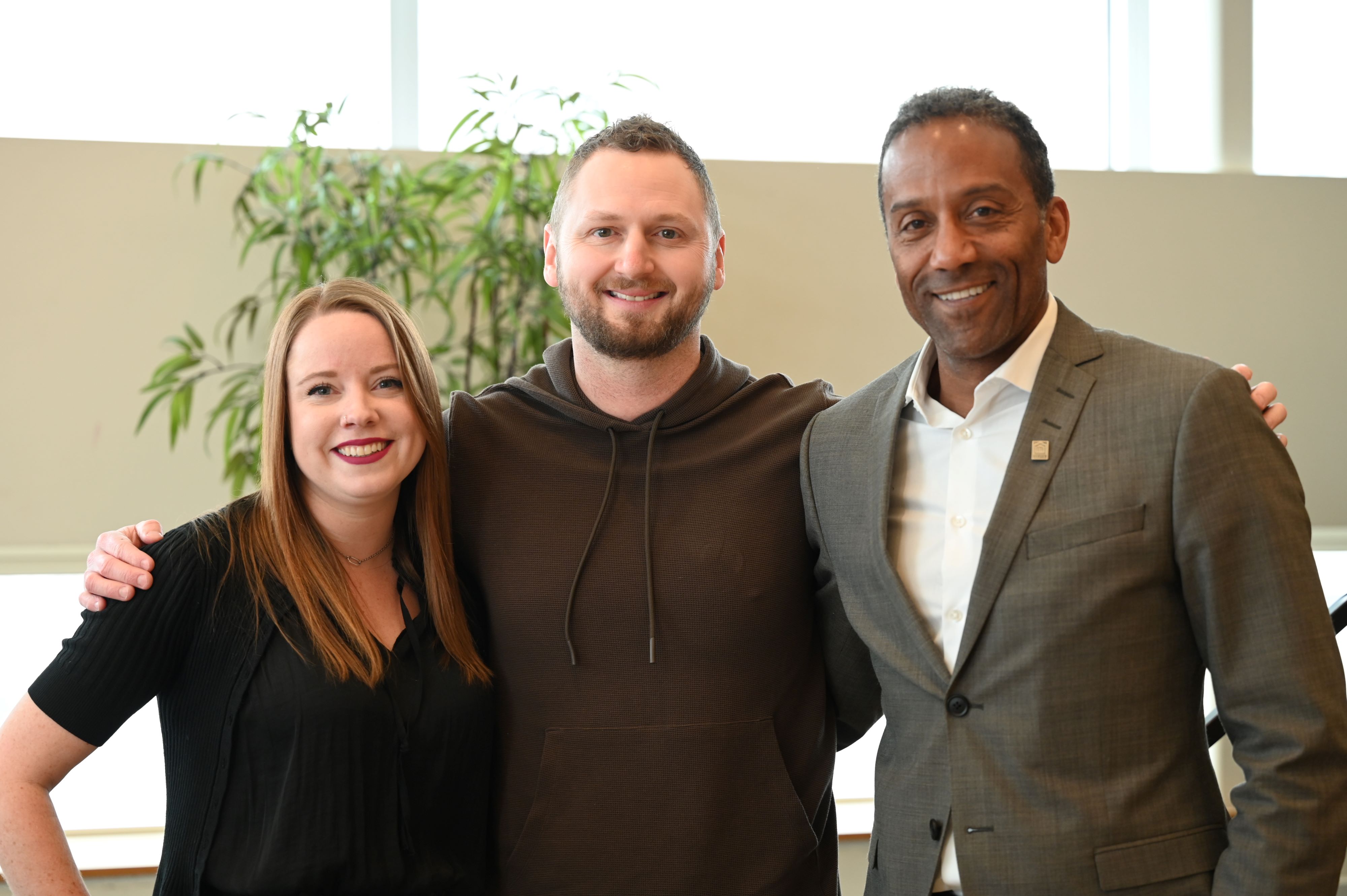 Kyle Braatz with Stéphane Brutus and the moderator for the CEO of the Year Breakfast