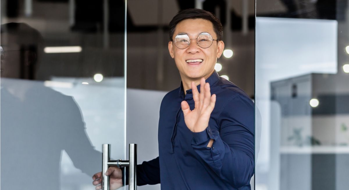 Man smiling at his first day at work