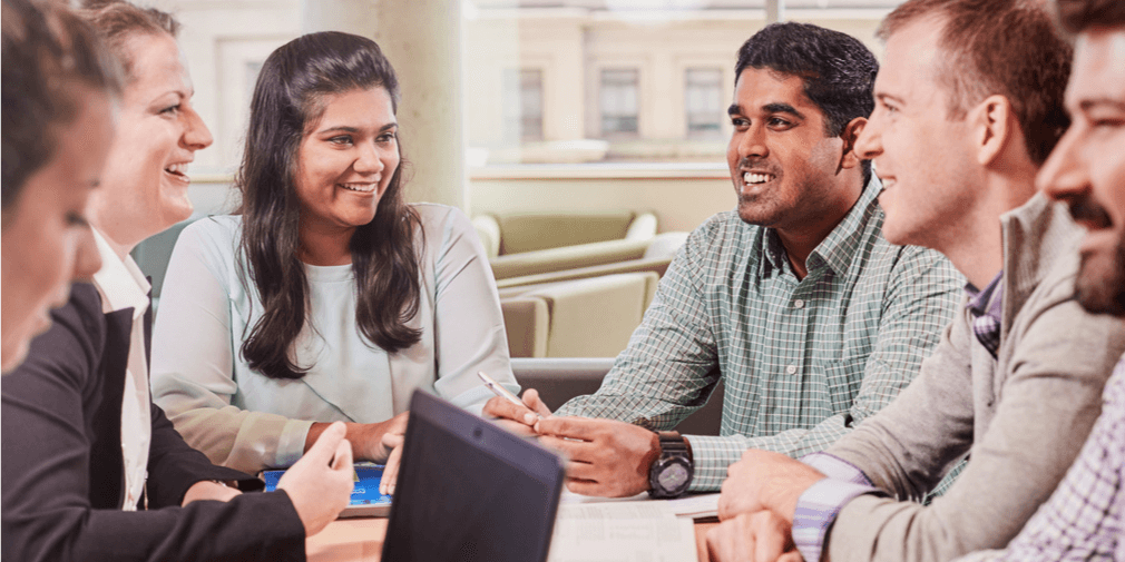 MBA students discussing a group project.