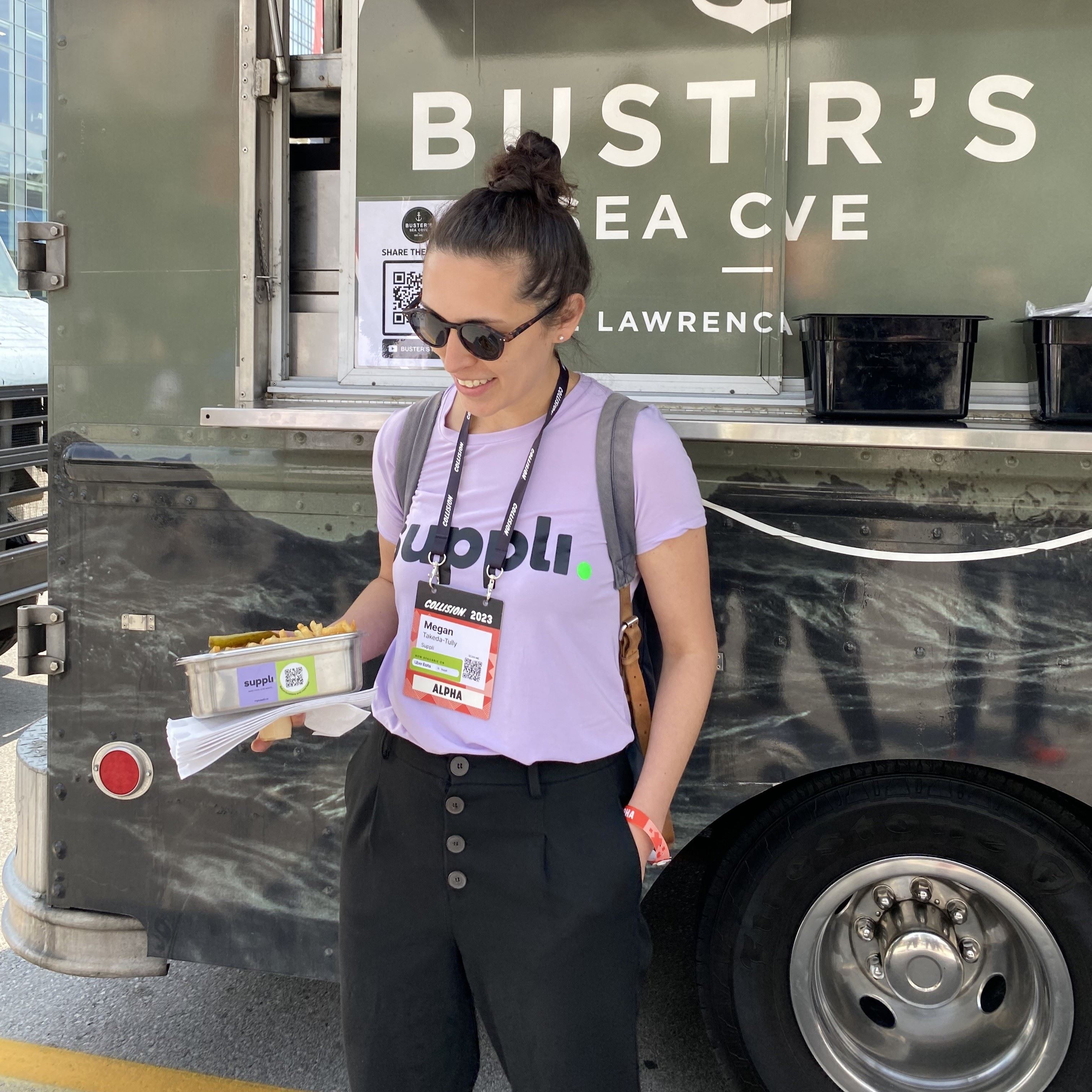 Megan Takeda-Tully holding a Suppli takeout container