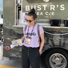 Megan Takeda-Tully stands in front of a food truck.