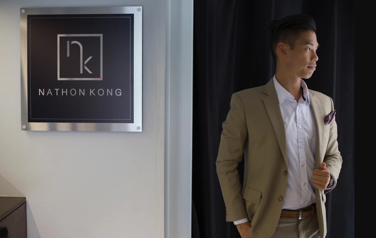 Nathon Kong standing next to the Nathon Kong store