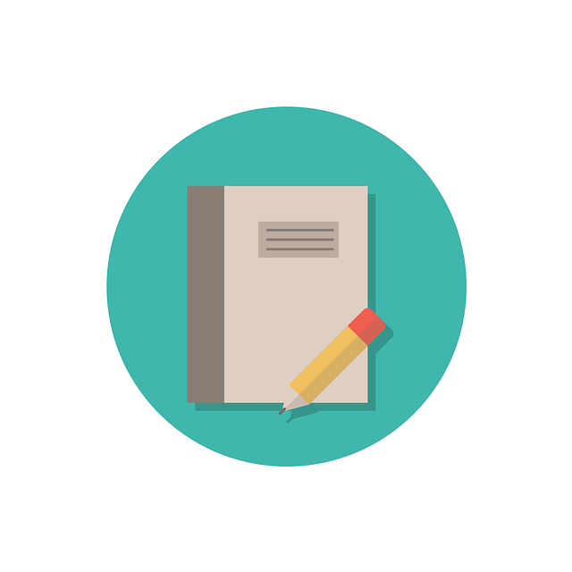 Notebook and pencil on a teal background