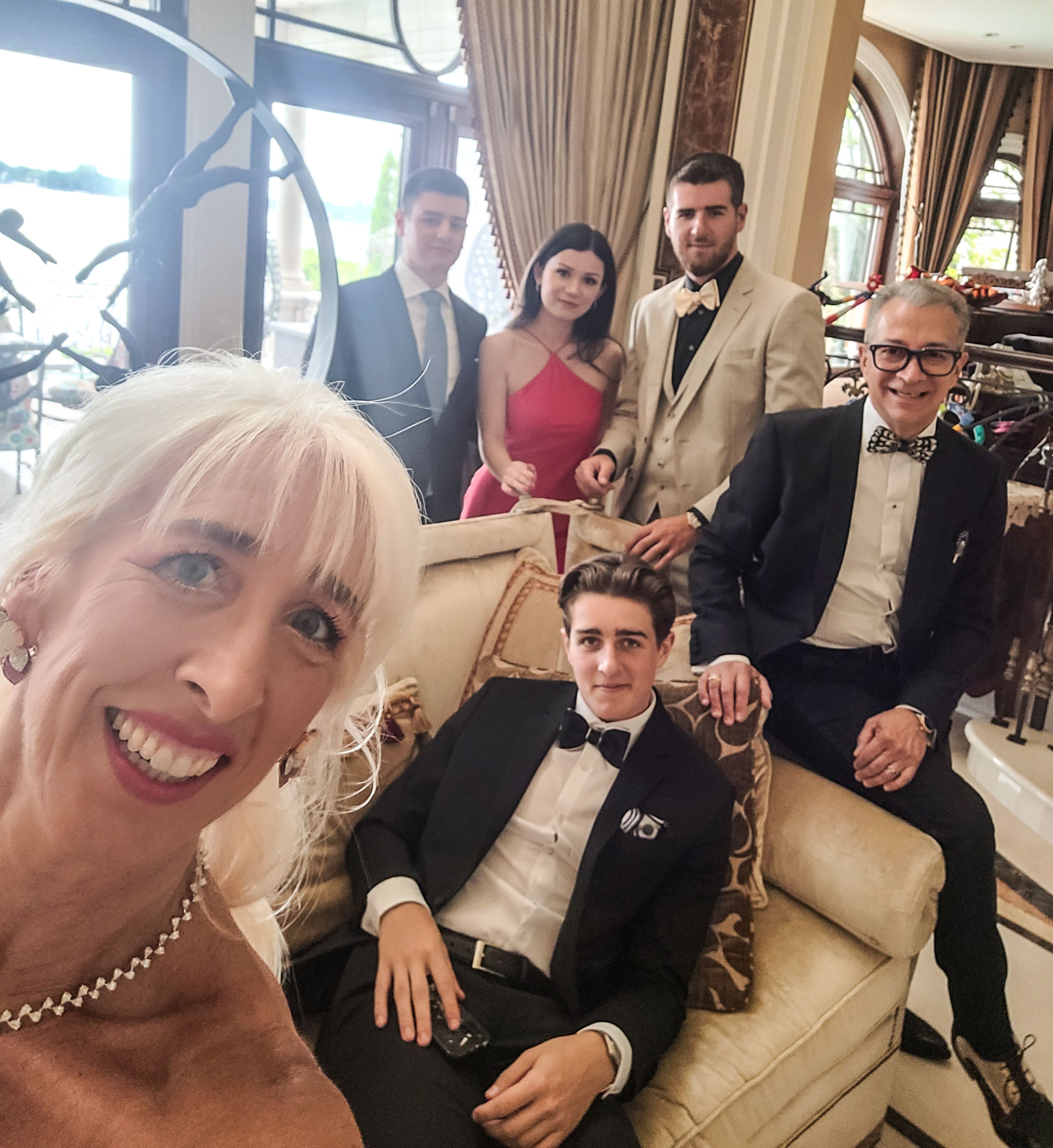 Patricia Saputo taking a selfie with her immediate family members.