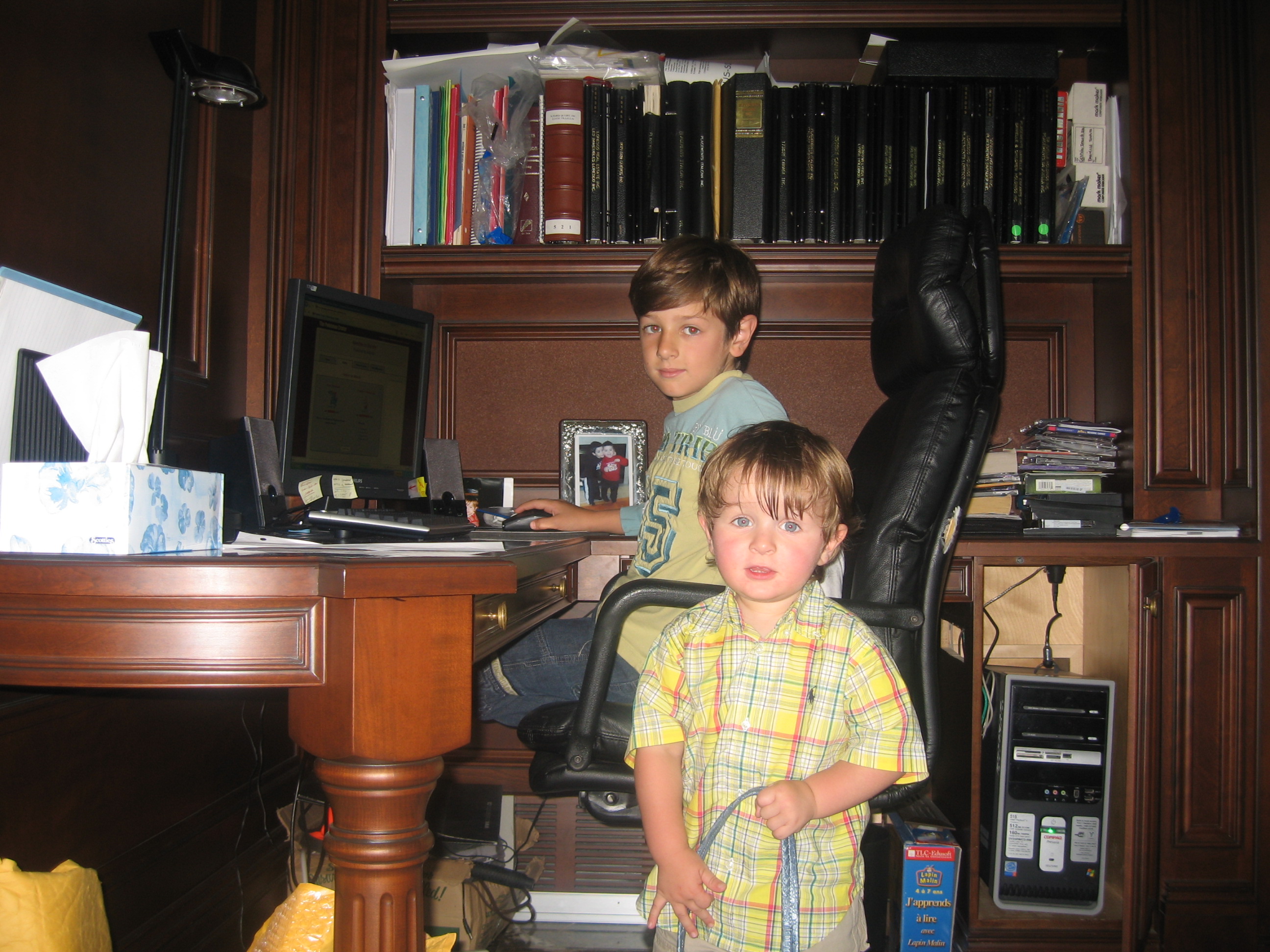 Patricia Saputo's sons Lorenzo (back) and Tommaso (front) in her home office, 2008.