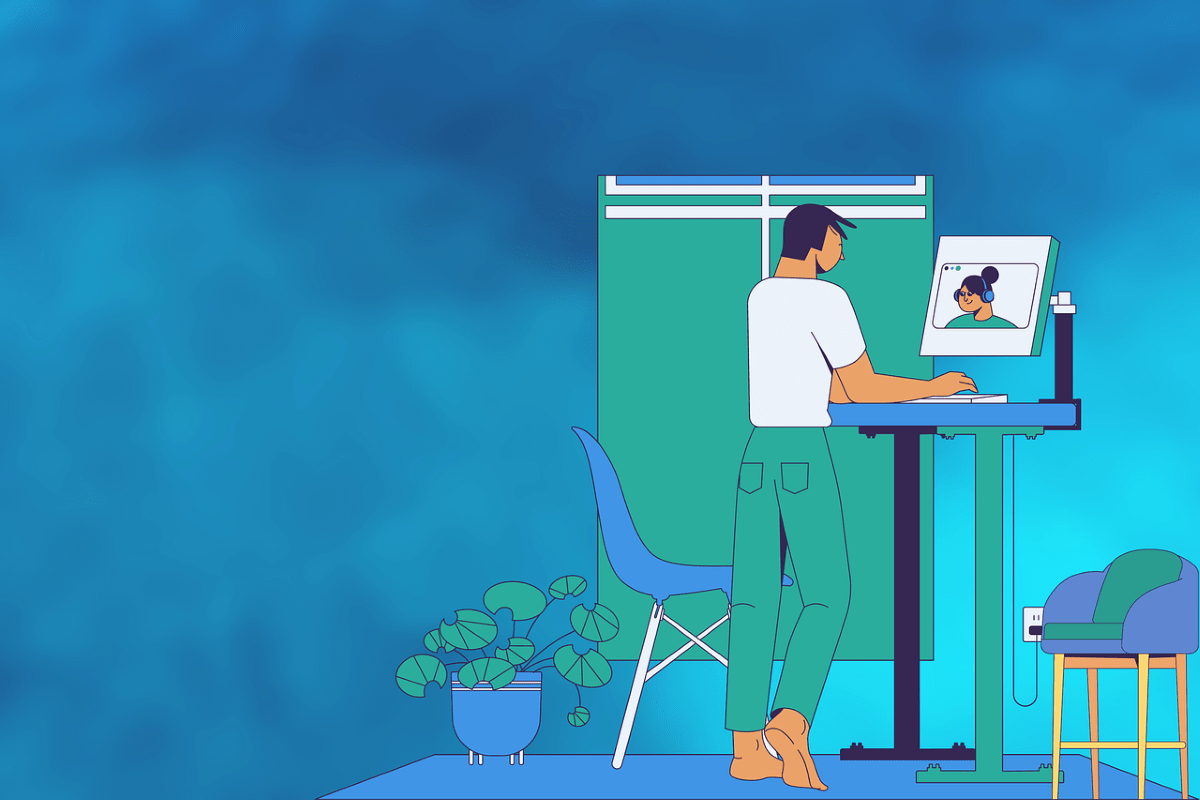 Person standing in front of their desk during a video call