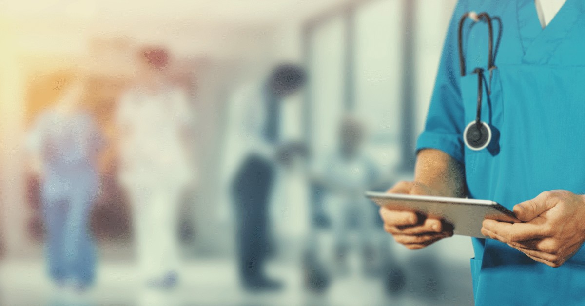 Hospital staff holding tablet