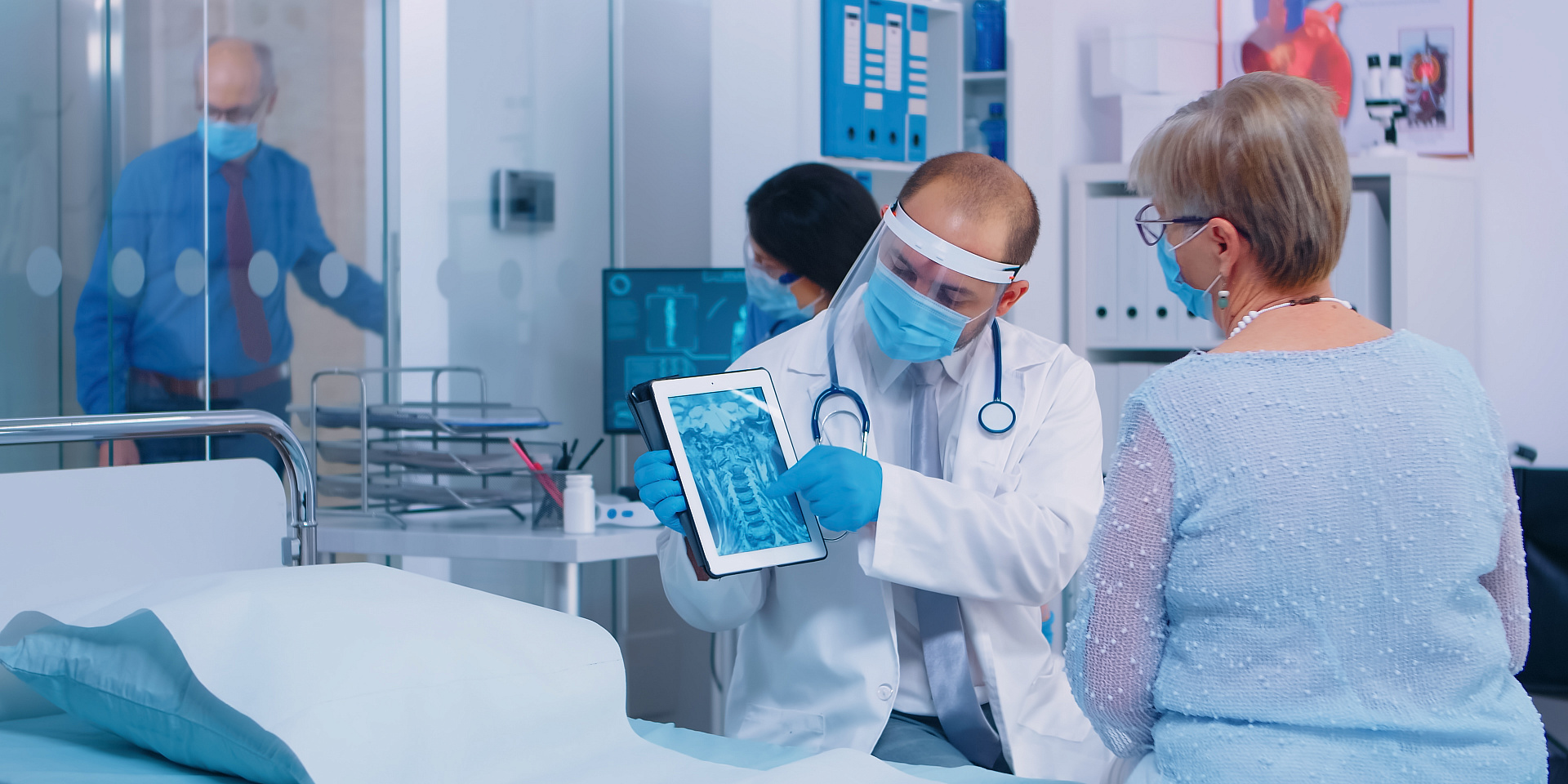 physician-showing-retired-woman-radiology-scan-on