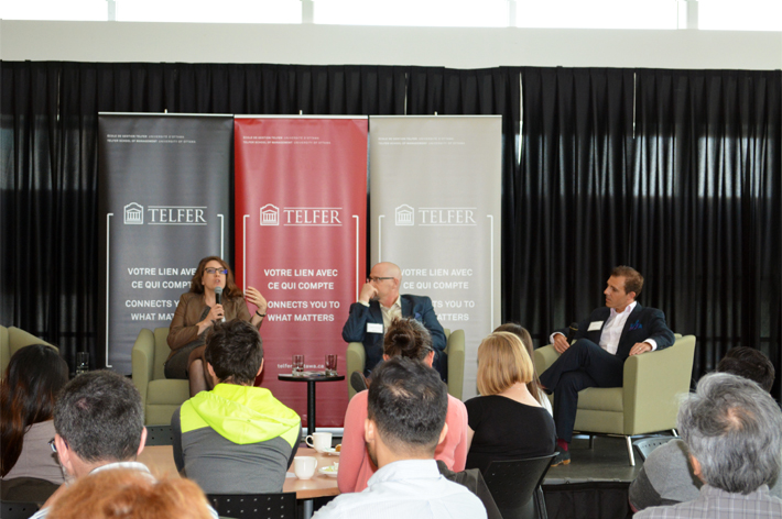 guest speakers in front of an audience