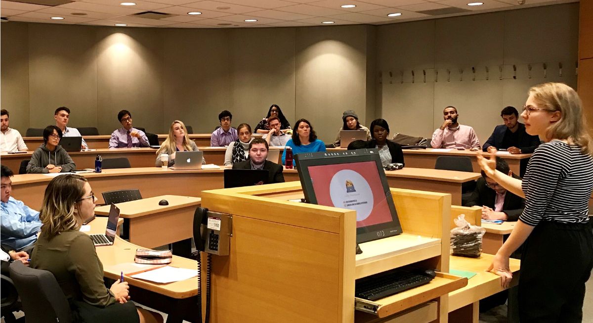 Professor presenting to a group of students