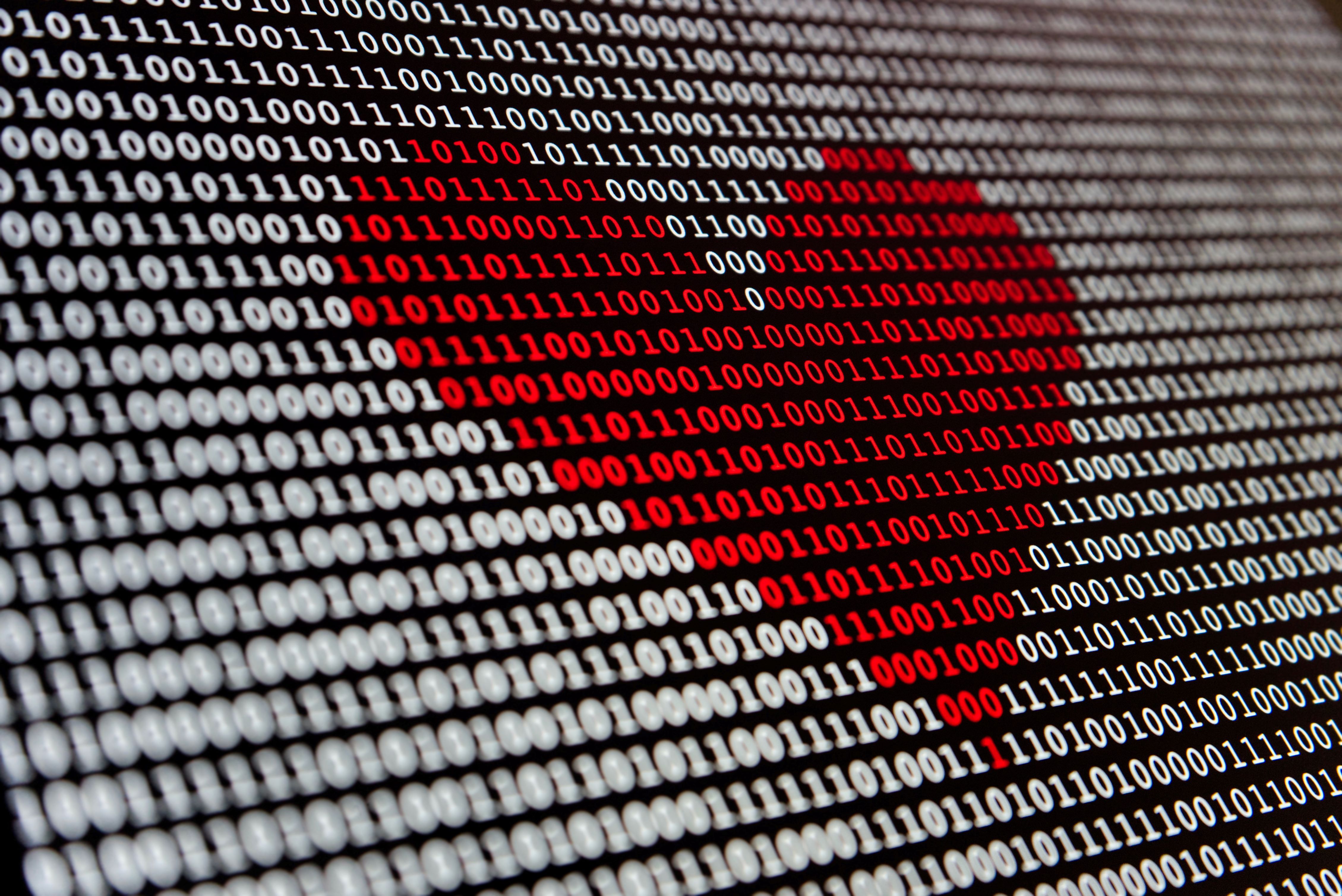 Red heart in binary code